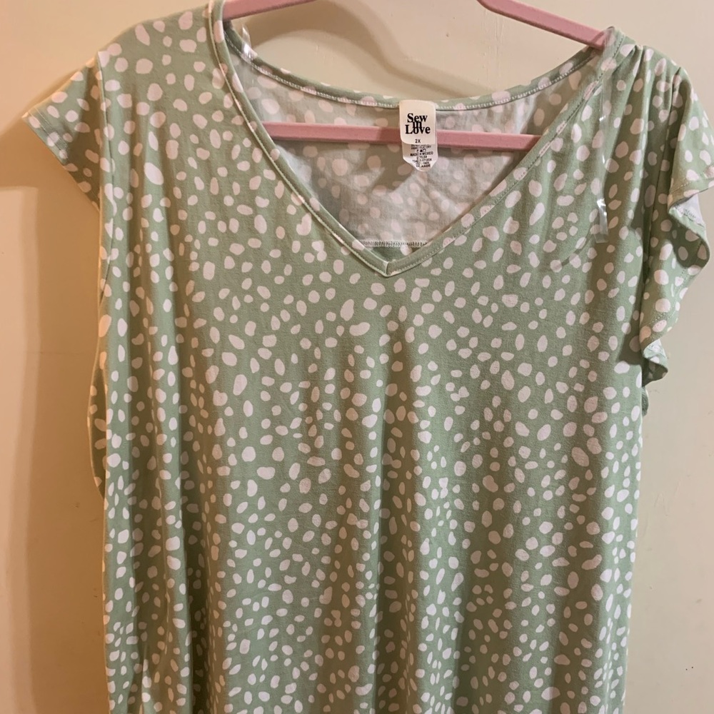NWOT lightweight blouse with cutout back detail. 2x